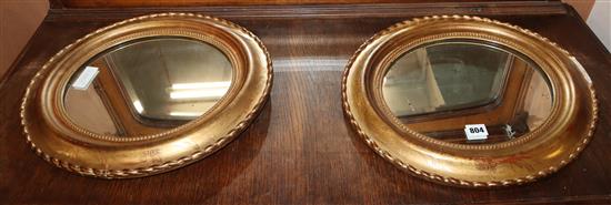 A pair of oval 19th century French giltwood wall mirrors H.45cm
